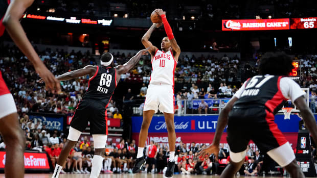 Jul 7, 2023; Las Vegas, NV, USA; Houston Rockets forward Jabari Smith Jr. (10) shoots the ball against Portland Trail Blazers center Duop Reath (68) during the second half at Thomas & Mack Center. Mandatory Credit: Lucas Peltier-USA TODAY Sports